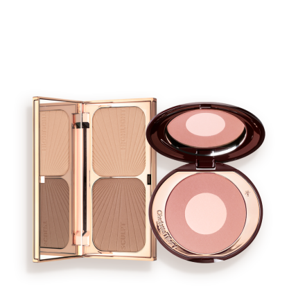 An open contouring and bronzing duo in a compact with a mirrored lid with an open, two-tone blush compact in a muted pink shade with a mirrored lid.