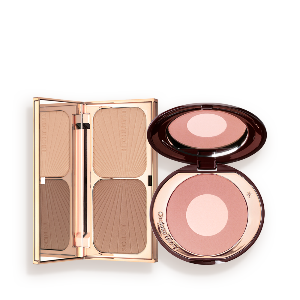 SCBRONZED__BLUSHING_BEAUTY_KIT_MAGICAL_SAVINGS-BUNDLE An open contouring and bronzing duo in a compact with a mirrored lid with an open, two-tone blush compact in a muted pink shade with a mirrored lid.