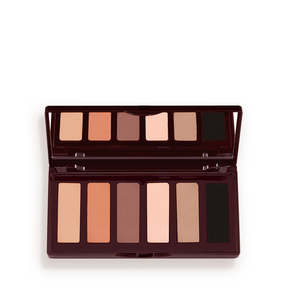 SUPER-NUDES-EASY-EYE-PALETTE An open, mirrored-lid six-pan eyeshadow palette with matte eyeshadows in brown, peach, and beige shades.