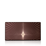 A closed eyeshadow palette with a black-coloured lid with a golden starburst patter on top.