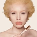 Fair-tone model wearing a radiant, skin-like concealer that covers her freckles, wrinkles, and dark circles, and makes her look fresh and youthful.