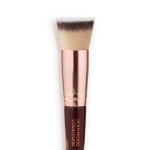 Close-up of a face blending contour brush with fawn, dark brown, and white-coloured bristles with rose-gold and dark crimson handle.
