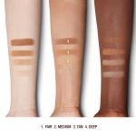 Deep, tan, and fair-tone arms with swatches of pressed powder in light, medium, tan, and deep.