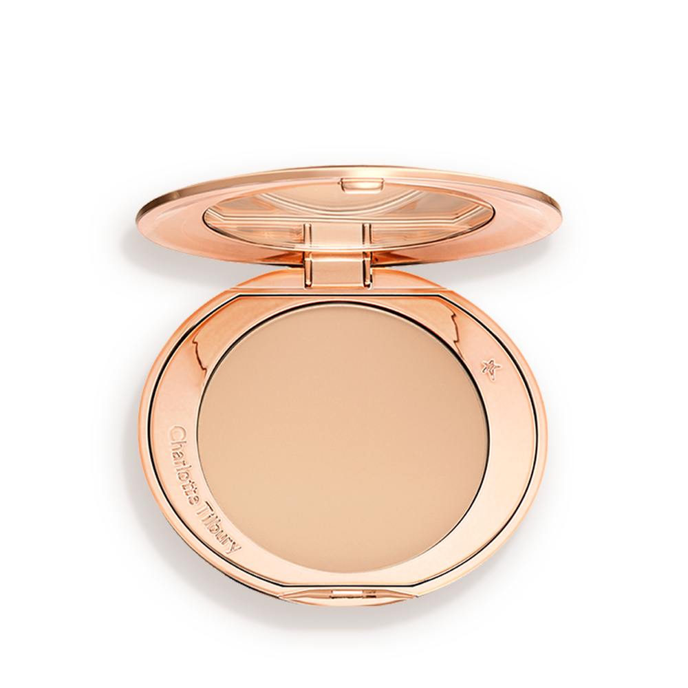 airbrush-flawless-medium-packshot An open, pressed powder compact in a light beige shade.